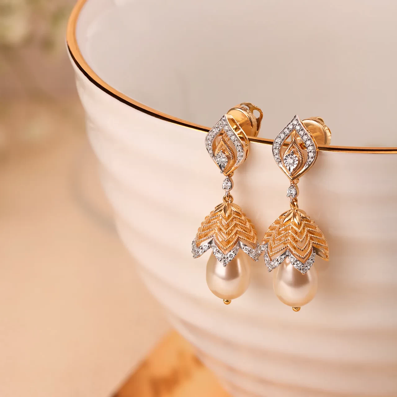 Leaflike Gold And Diamond Studded Jhumkas
