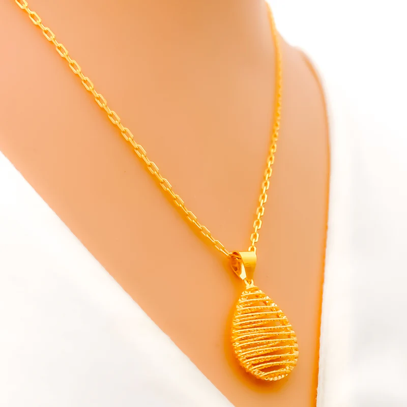 Radiant 22k Gold Teardrop Pendant with Striped Design