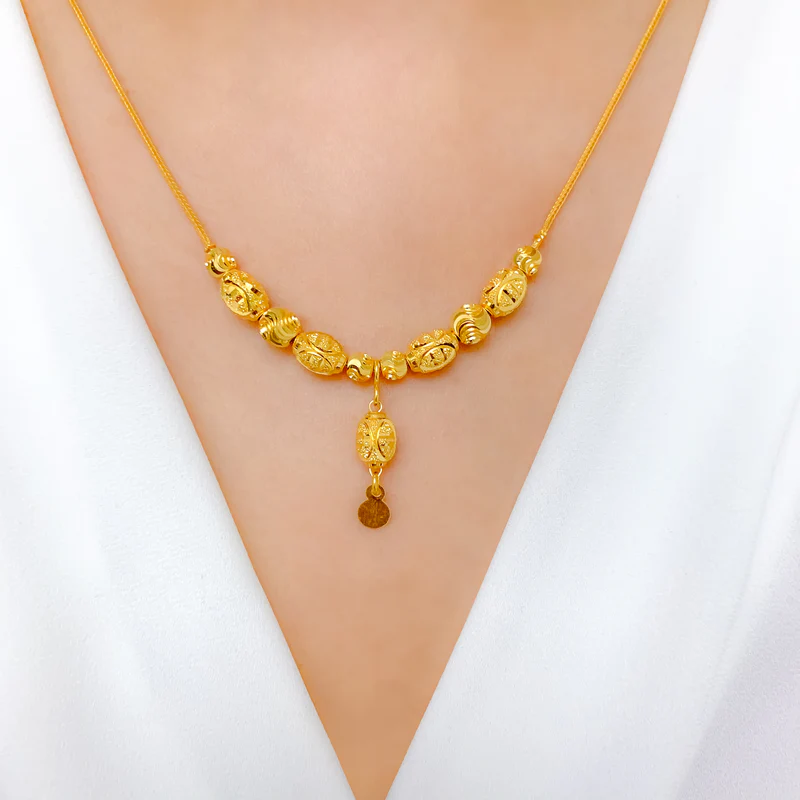 Elegant Gold Necklace with Decorative Details
